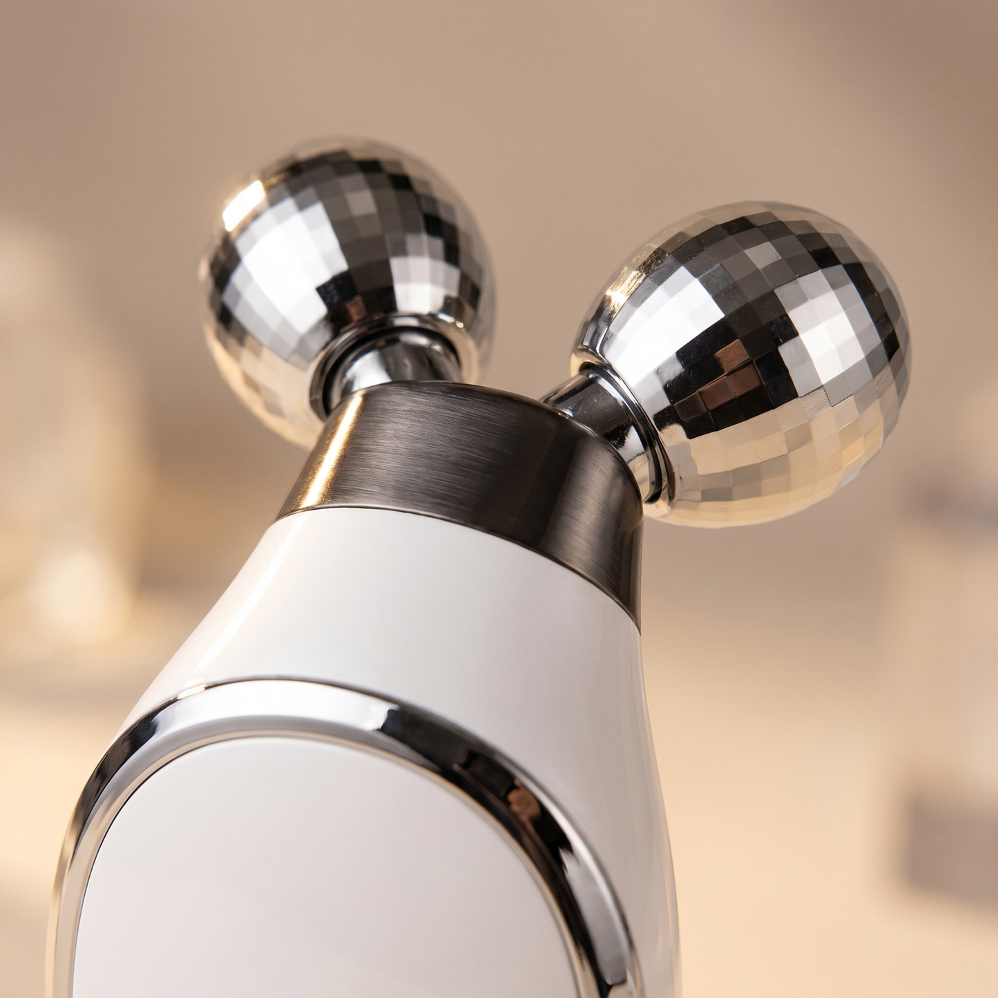 Microcurrent face sculptor — chrome rollers close-up